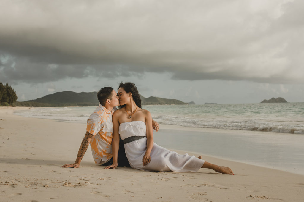 Couple kissing on a tropical beach in hawaii. 