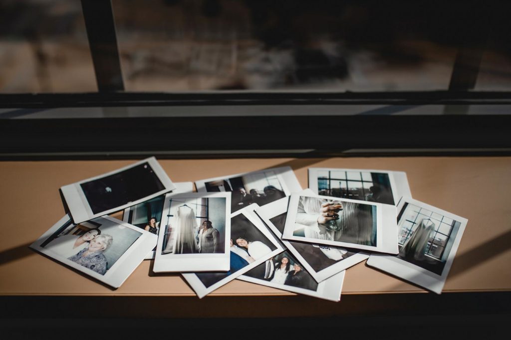 Stack of poloroid photos on wedding day
