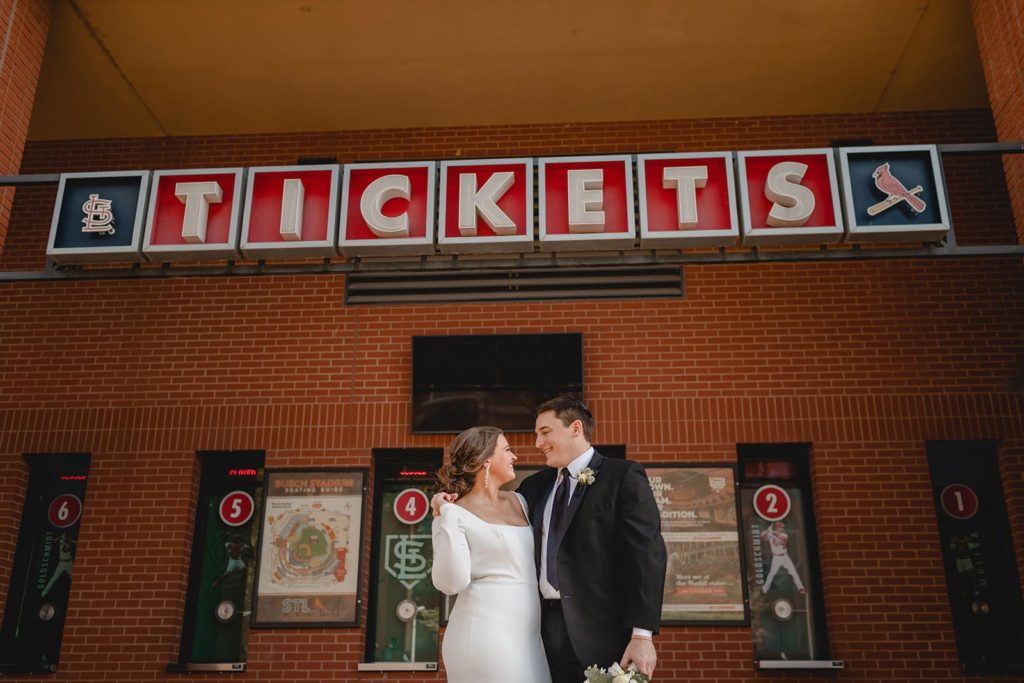 Bride and groom at Busch stadium ticket office 