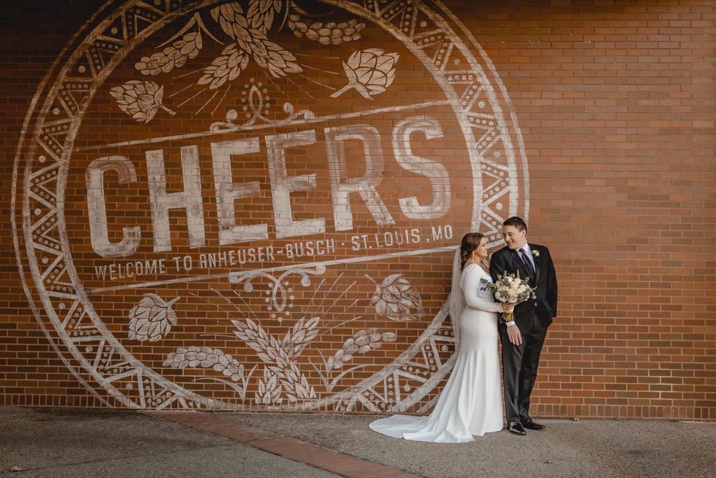 Bride and groom posing at Anheiser Busch Brewery