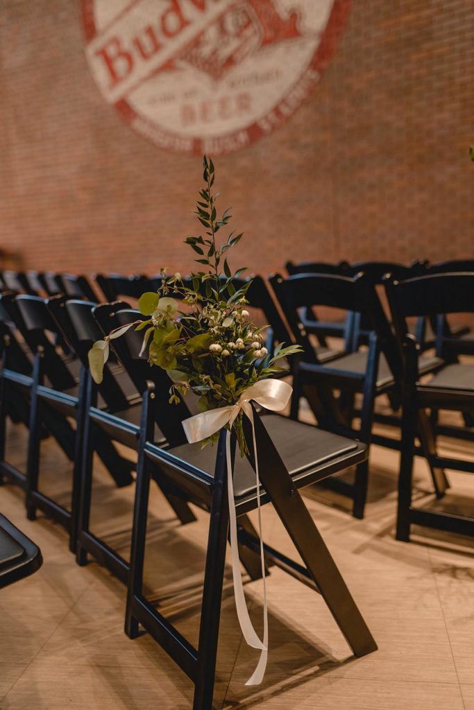 Anheuser Busch Brewery Wedding detail shot of chairs with greenery