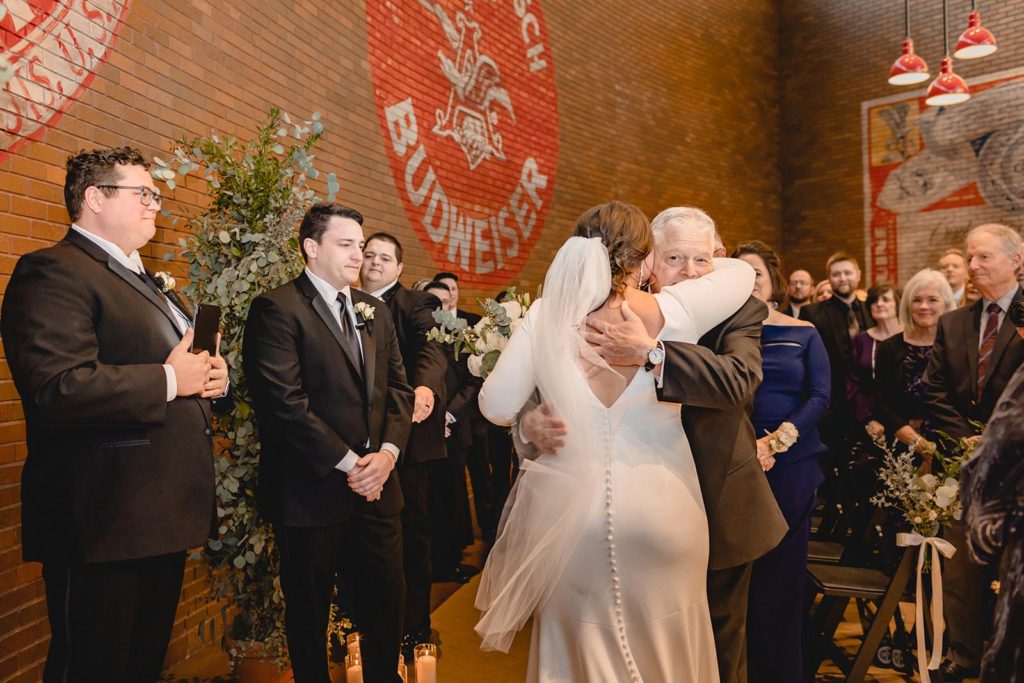 Father of bride giving away his daughter at Anheuser Busch Brewery