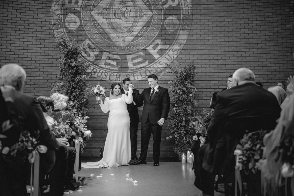 Bride and groom celebrating wedding at STL Anheuser Busch brewery