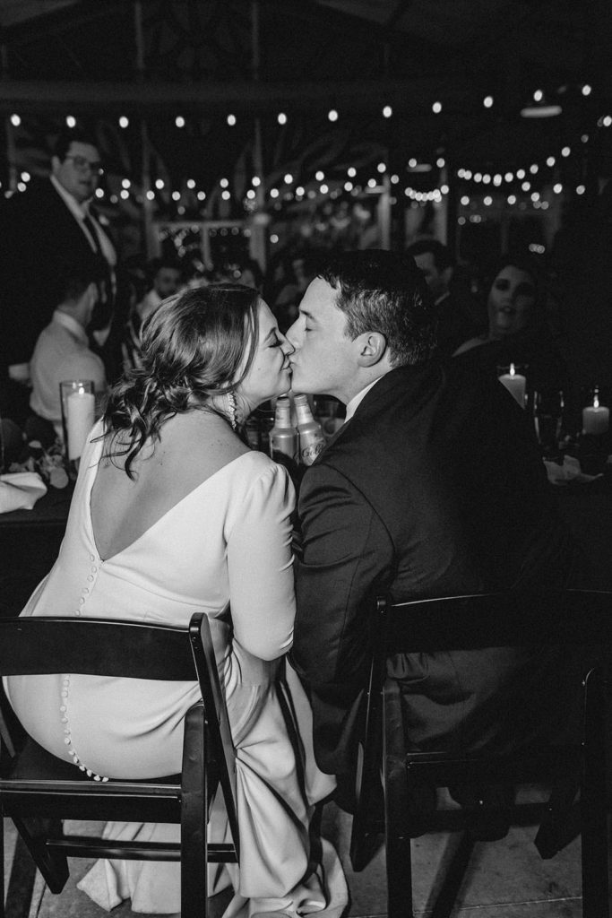 Bride and groom black and white kissing photo at Anheuser Busch Brewery reception