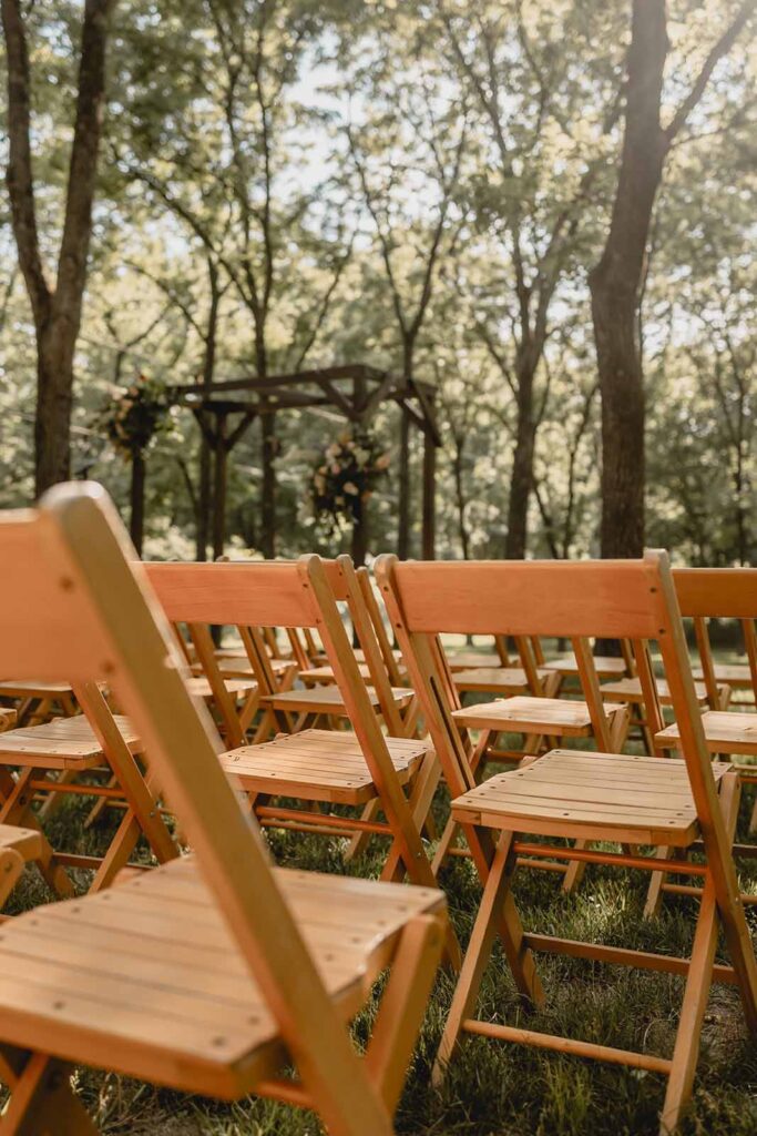 Close up of wooden wedding ceremony folding chairs