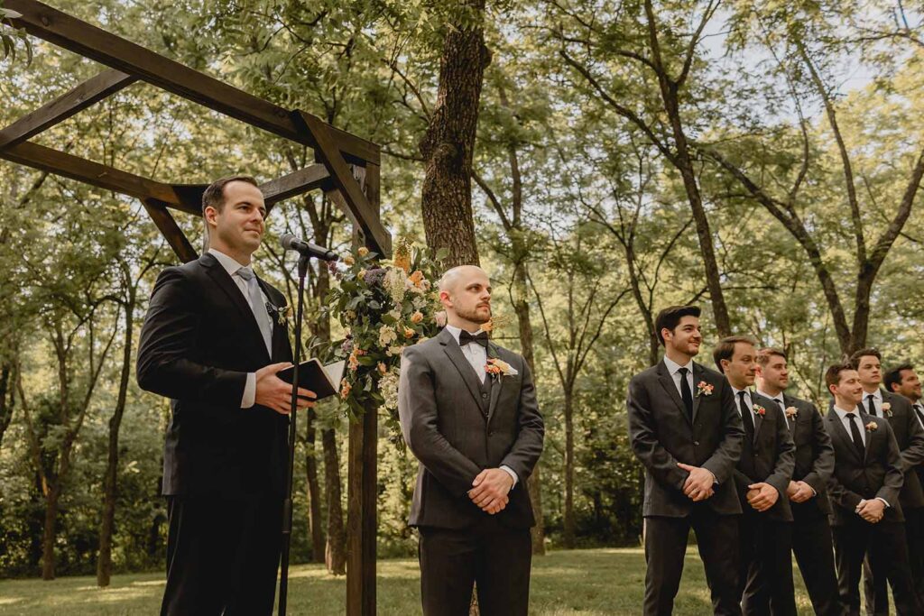Grooms reaction as he looks towards his bride walking down the aisle