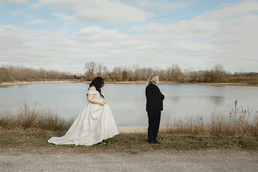 gif of a wedding first look and grooms reaction in front of a winter lake