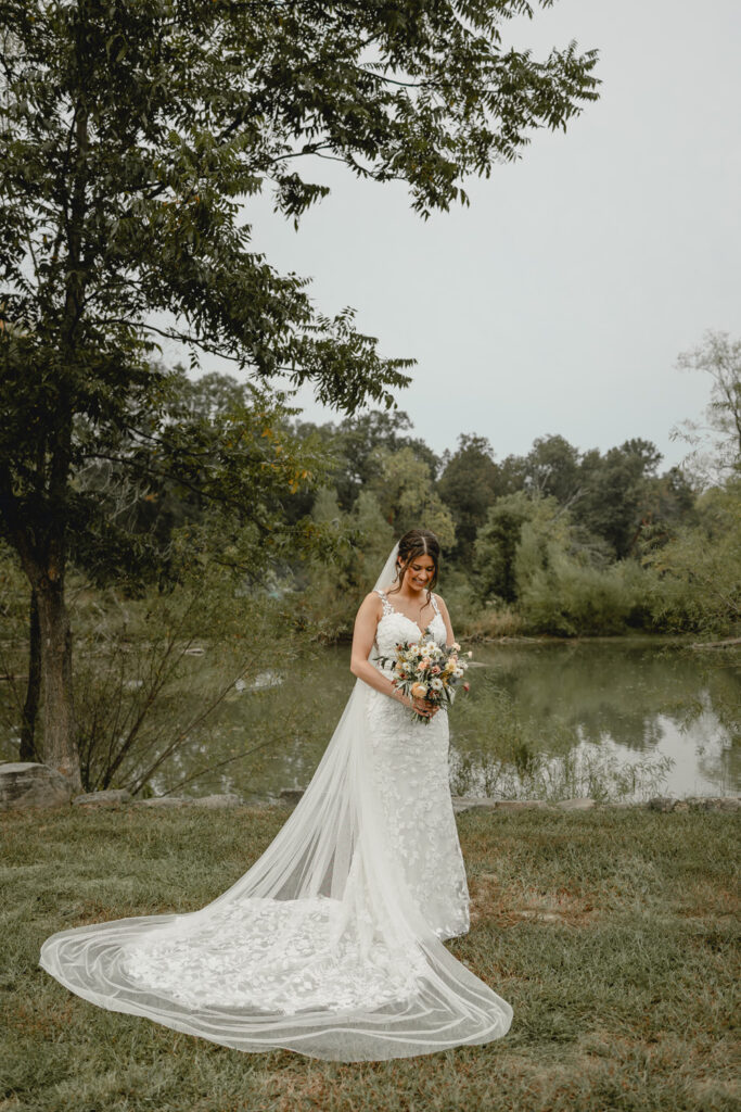 Bride looking at her flower at lost hill lake 