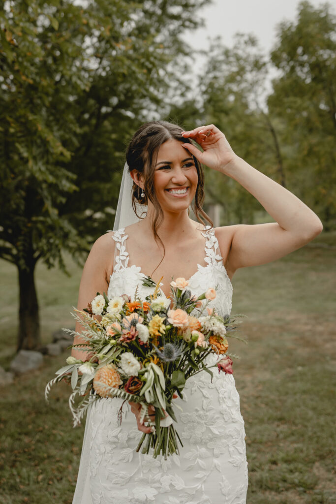 Face of shot of bride holding bouquet of flower and smiling
