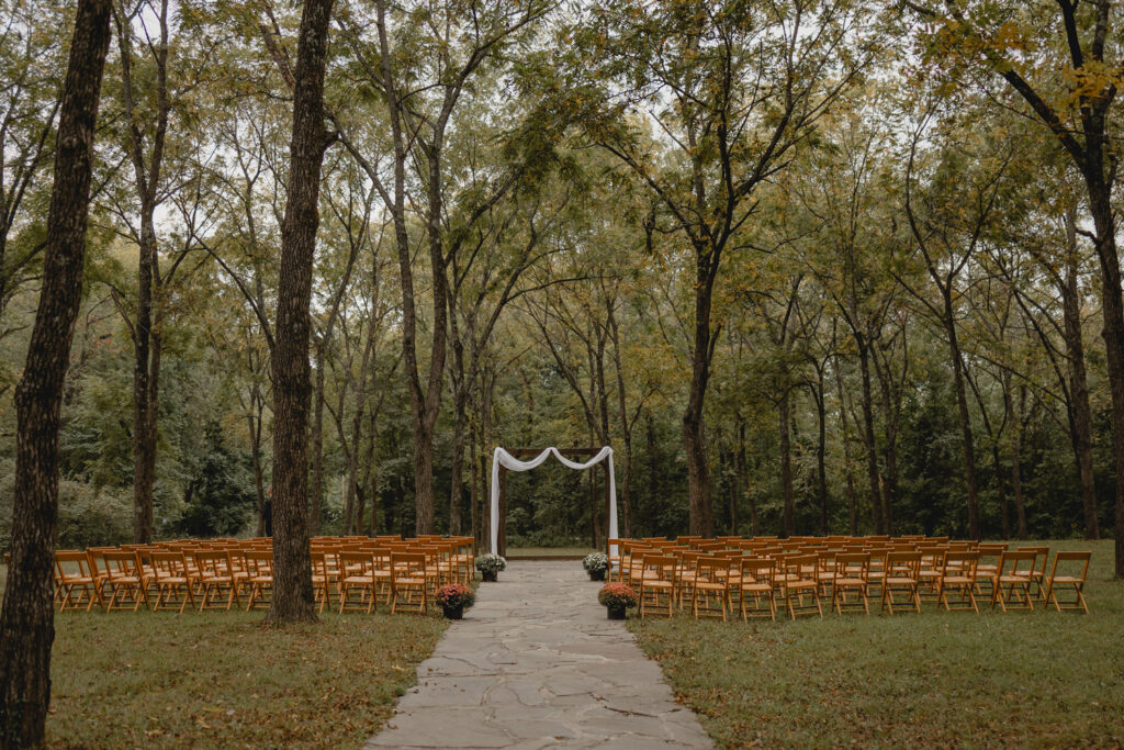 Arbor and wooded chairs at lost hill lake wedding venue