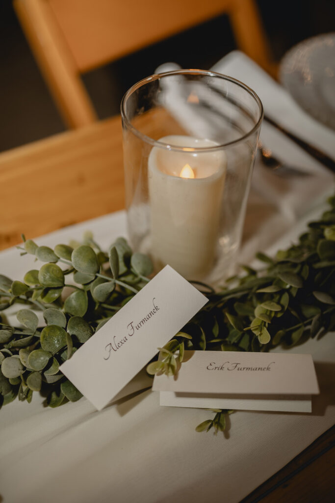 Table details with candle at wedding reception.