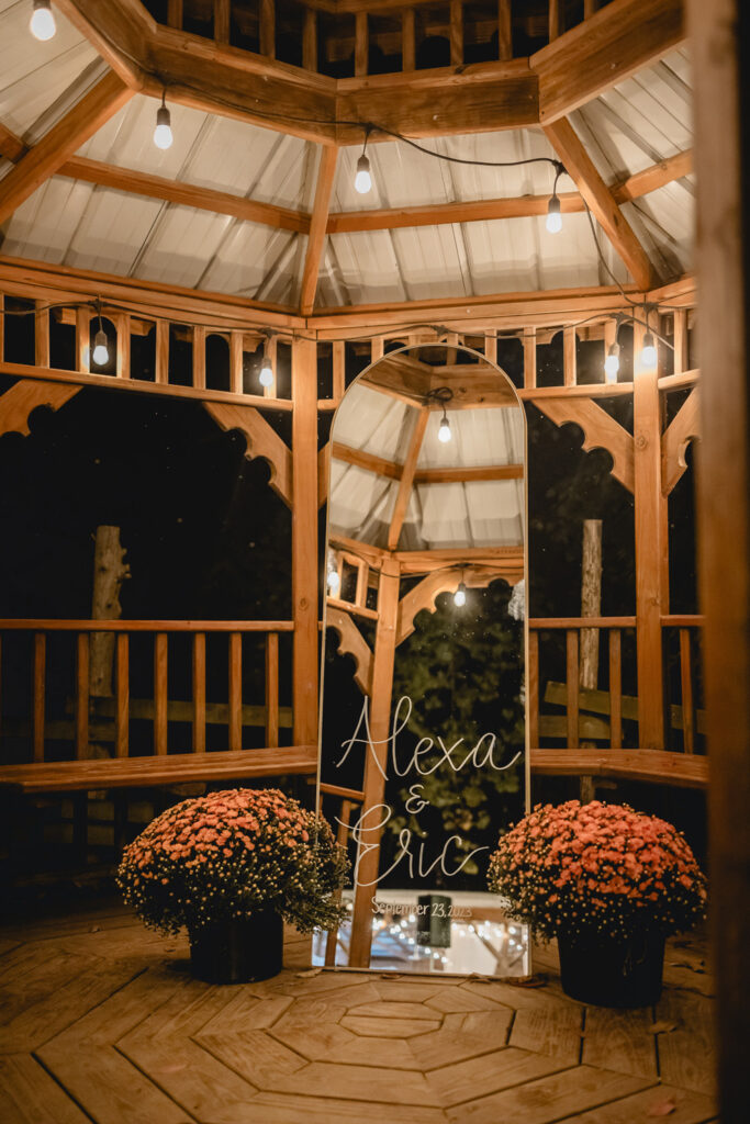 Romantic lit pavilion at wedding reception.